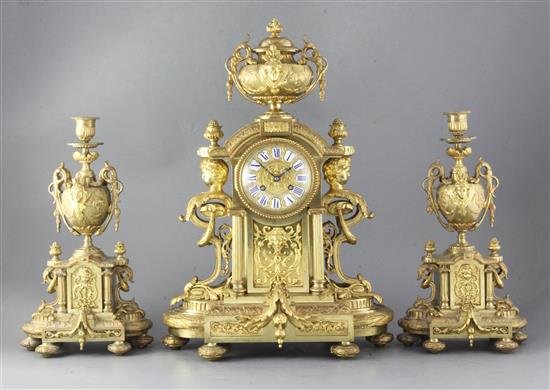 A third quarter of the 19th century French ormolu clock garniture, 20.5in.